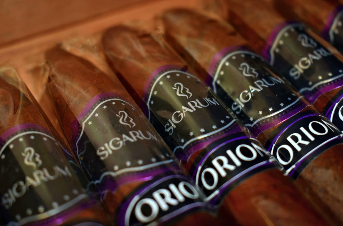 Orion Torpedo cigars resting in the open box